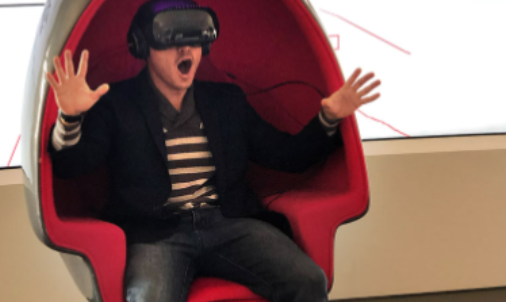 A visually exited person sitting in a Voyager motion chair